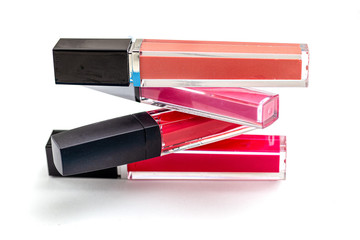 Lipgloss Pyramid. Lip gloss on a white background. Beauty background. Cosmetics concept.