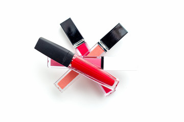 Lipgloss Pyramid. Lip gloss on a white background. Beauty background. Cosmetics concept. Flat lay