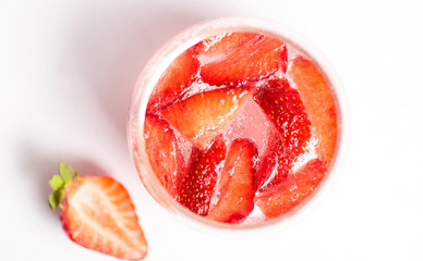 Strawberry juice in a glass isolated