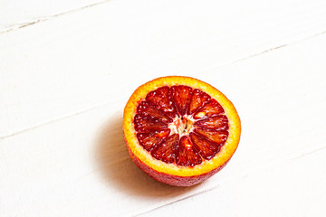 Ripe red orange on a white background.