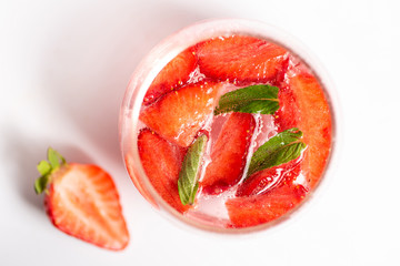 Strawberry juice in a glass isolated