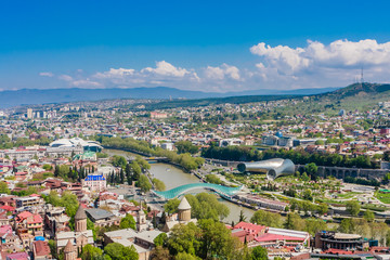 Fototapeta premium Panoramic view of Tbilisi city from the Narikala Fortress, old town and modern architecture. Georgia