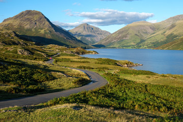 Winding roads towards Wasdale head and Scafell Pike on a summer afternoon with blue skies and calm...