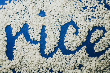 Rice texture. Word written from food. Classic blue pantone