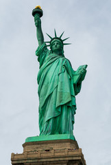 The Statue of Liberty and tourist deck against a grey sky during September 2018