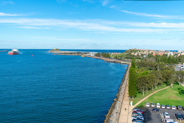 Naklejka na ściany i meble Landscape photo of the Newcastle sea front in New South Wales during the summer