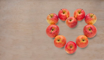 Apples on plywood background