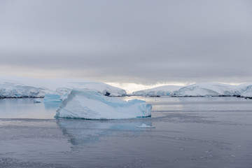 Antarctic landscape with iceberg, view from expedition ship