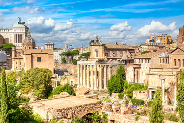 Fototapeta na wymiar Panoramic cityscape view of the Roman Forum and Roman Altar of the Fatherland in Rome, Italy. World famous landmarks in Italy during summer sunny day