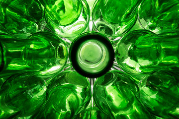 glass empty beer bottles lie in rows, open the necks on the camera