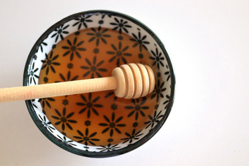 Honey with wooden honey dipper