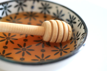 Honey with wooden honey dipper