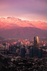 skyscrapers at sunset with mountain
