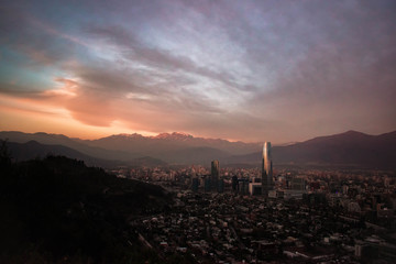 skyscrapers at sunset with mountain