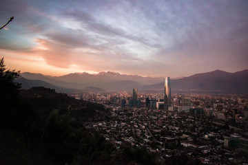skyscrapers at sunset with mountain