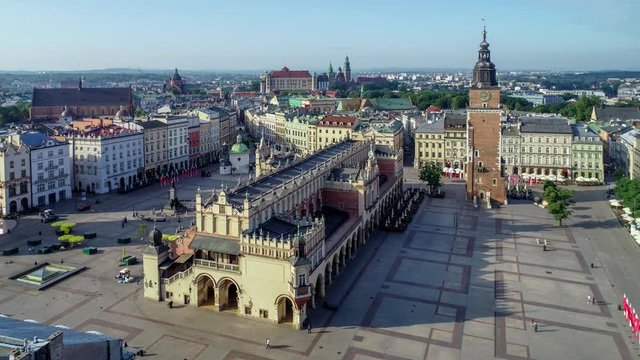 Krakow, Poland. Aerial video of old city, with Main Market Square (Rynek), old drapers&rsquo; hall (Sukiennice), Mickiewicz statue, St. Adalbert small church and far view of Wawel castle and cathedral