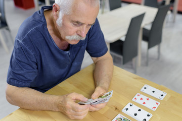 portrait of a man playing cards