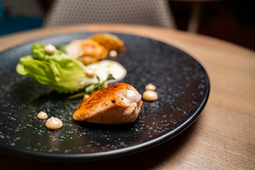 Fine food, fine dinning, grilled chicken  with sauce and salad 