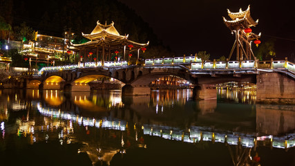 fenghuang chinese bridge by night