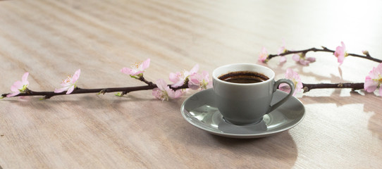 Fresh italian style coffee next to flower bouquet
