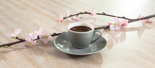 Fresh italian style coffee next to flower bouquet