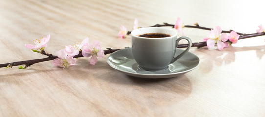 Fresh italian style coffee next to flower bouquet