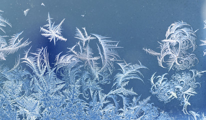 frost crystal on window glass in winter season