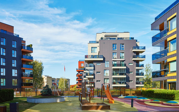 Modern complex of apartment residential buildings and children playground