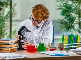 Young crazy chemist working in the lab
