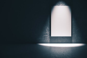 Blank white poster in dark concrete room.