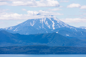 Fototapeta na wymiar Vilyuchinsky volcano, Kamchatka peninsula, Russia. It is located southwest of the city of Petropavlovsk-Kamchatsky behind Avacha Bay.