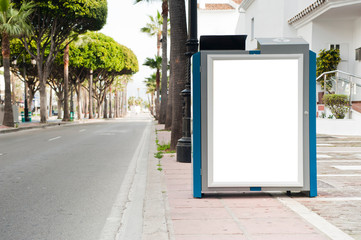 Billboard, banner, empty, white in the city center with , green plants