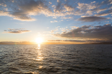 Golden sunset in the sky over the Avacha Bay, Kamchatka Peninsula, Russia.