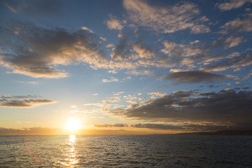 Obraz premium Golden sunset in the sky over the Avacha Bay, Kamchatka Peninsula, Russia.