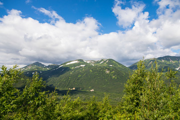 Fototapeta premium Vilyuchinsky Pass, Kamchatka Peninsula, Russia. It is located at an altitude of about 1000 meters above sea level overlooking the Vilyuchinsky volcano.