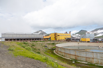Fototapeta na wymiar Mutnovskaya Geothermal Power Station, Kamchatka Peninsula, Russia - August 11, 2018: The station is located northeast of the Mutnovskaya hill, at an altitude of about 800 meters above sea level.