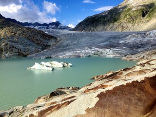 RHONE GLACIER, SWITZERLAND - AUGUST 16, 2016: Rhone glacier at Furkapass is melting - obrazy, fototapety, plakaty