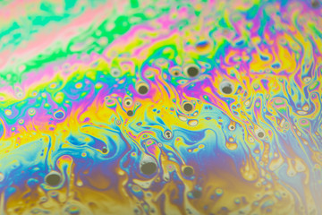 Psychedelic abstract background. Photo macro shot with light interference on the surface of a soap bubble