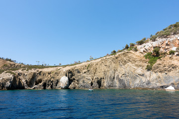 Rocky coast and gorgeous waters in Kelyfos islet, Marmaras, Chalkidiki, Greece