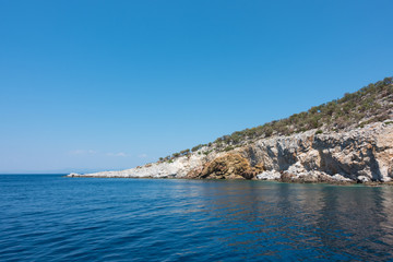 Rocky coast and gorgeous waters in Kelyfos islet, Marmaras, Chalkidiki, Greece