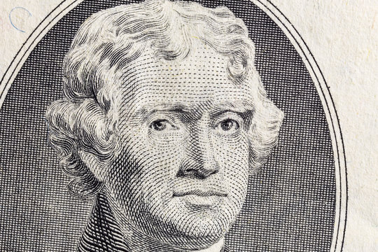 Close up macro photograph of President Thomas Jefferson on the US two dollar bill.