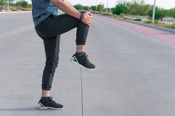 Man stretching his body with sportswear