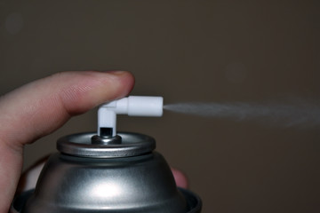 hand with spray can