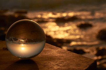 Sunrise in an Andalusian beach with a point of view from inside of a crystal ball
