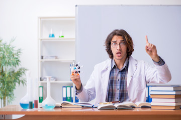 Chemistry lecturer during lecture in college