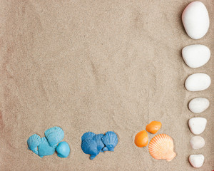 sets of 3-color cochas, blue, light blue, orange and white stones on beach sand