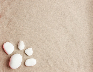 Fototapeta na wymiar Beach sand with white stones, space to write