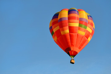 bright beautiful hot air balloon close up in the blue sky