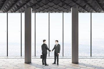 Business people shake hands