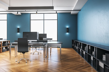 Blue coworking office interior with computer
